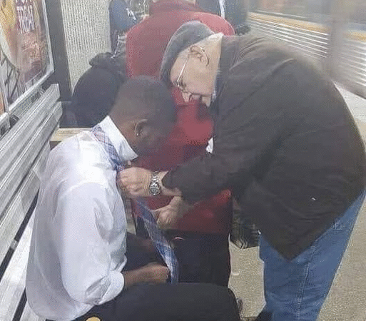 A Tie, a Touch, and a Moment of Community…b